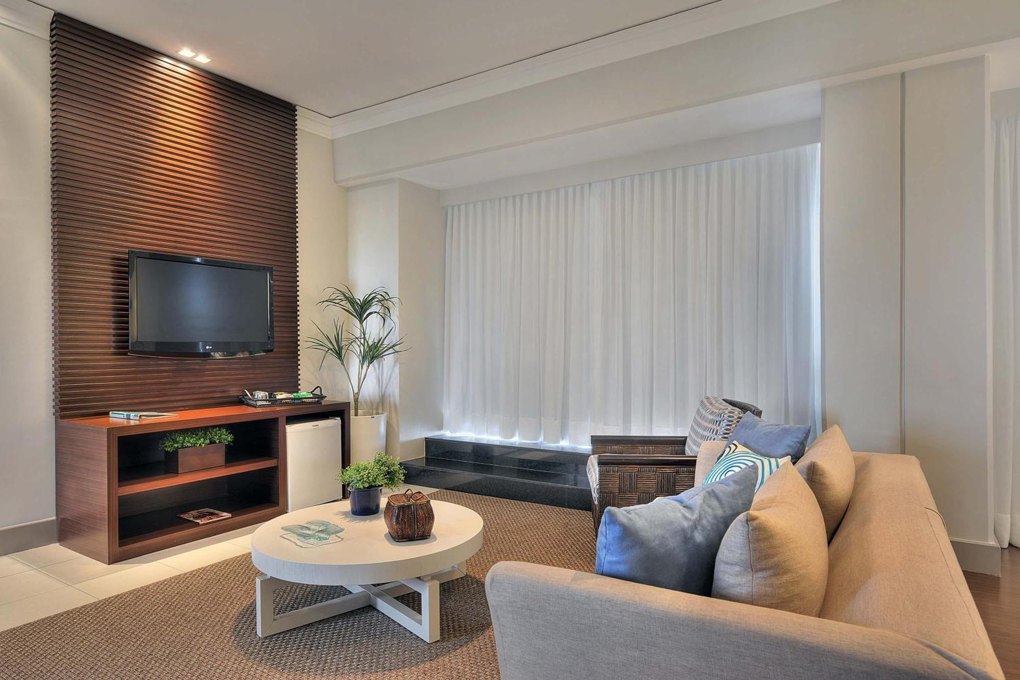 فندق ديفيل برايم سلفادور السلفادور المظهر الخارجي الصورة A living room with a television